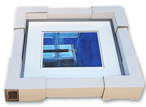Framed artwork shown with Art Guardrails ready to be secured with shrink wrap. 
